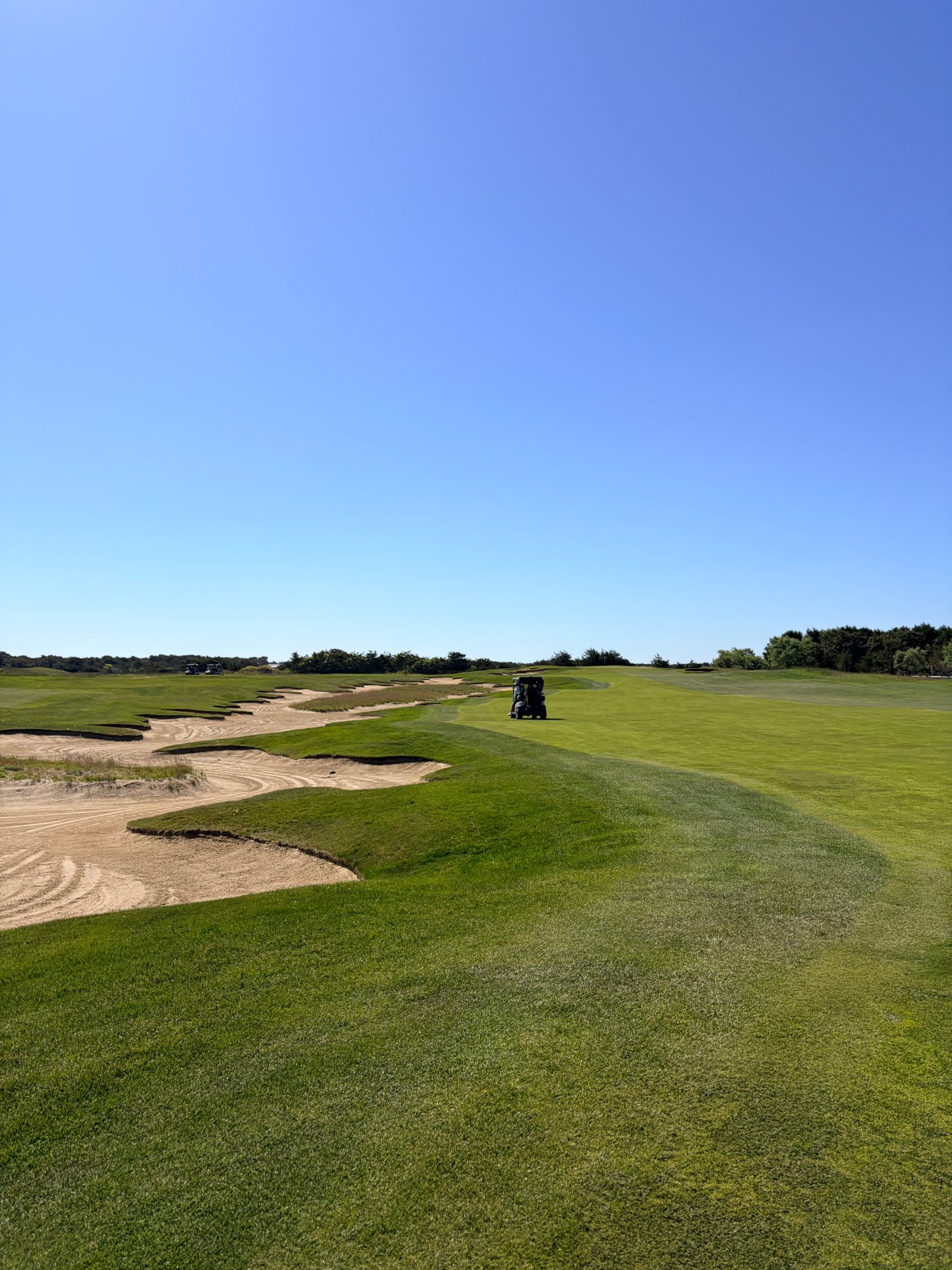 Wide links-style fairway with sprawling sandy waste bunkers at Miacomet Golf Club on Nantucket, Massachusetts