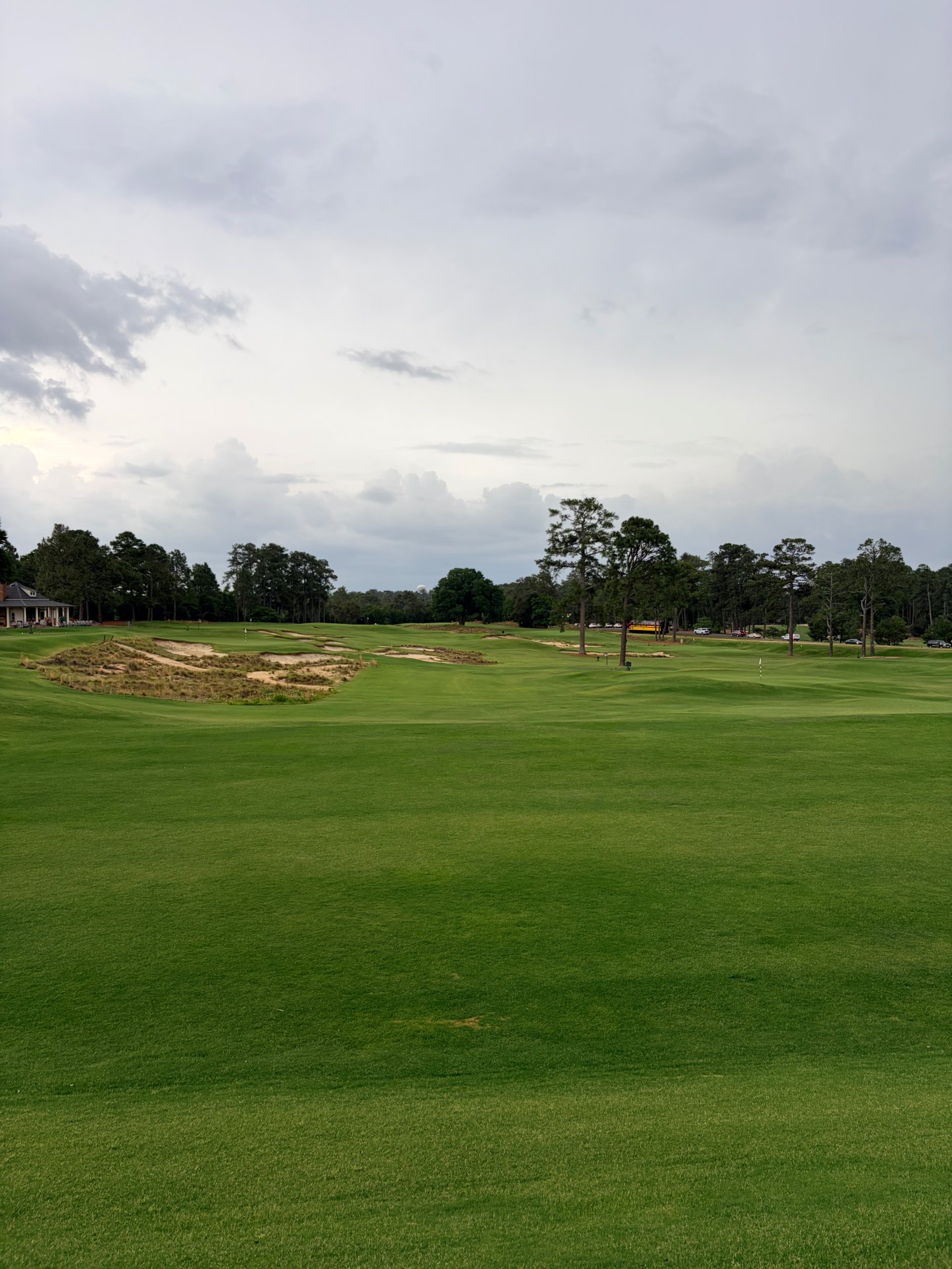 Fairway view at The Cradle at Pinehurst with sandy waste areas and pines