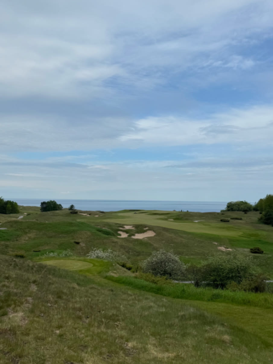 Bluffs Course at Arcadia Bluffs with fairway bunkers and Lake Michigan on the horizon