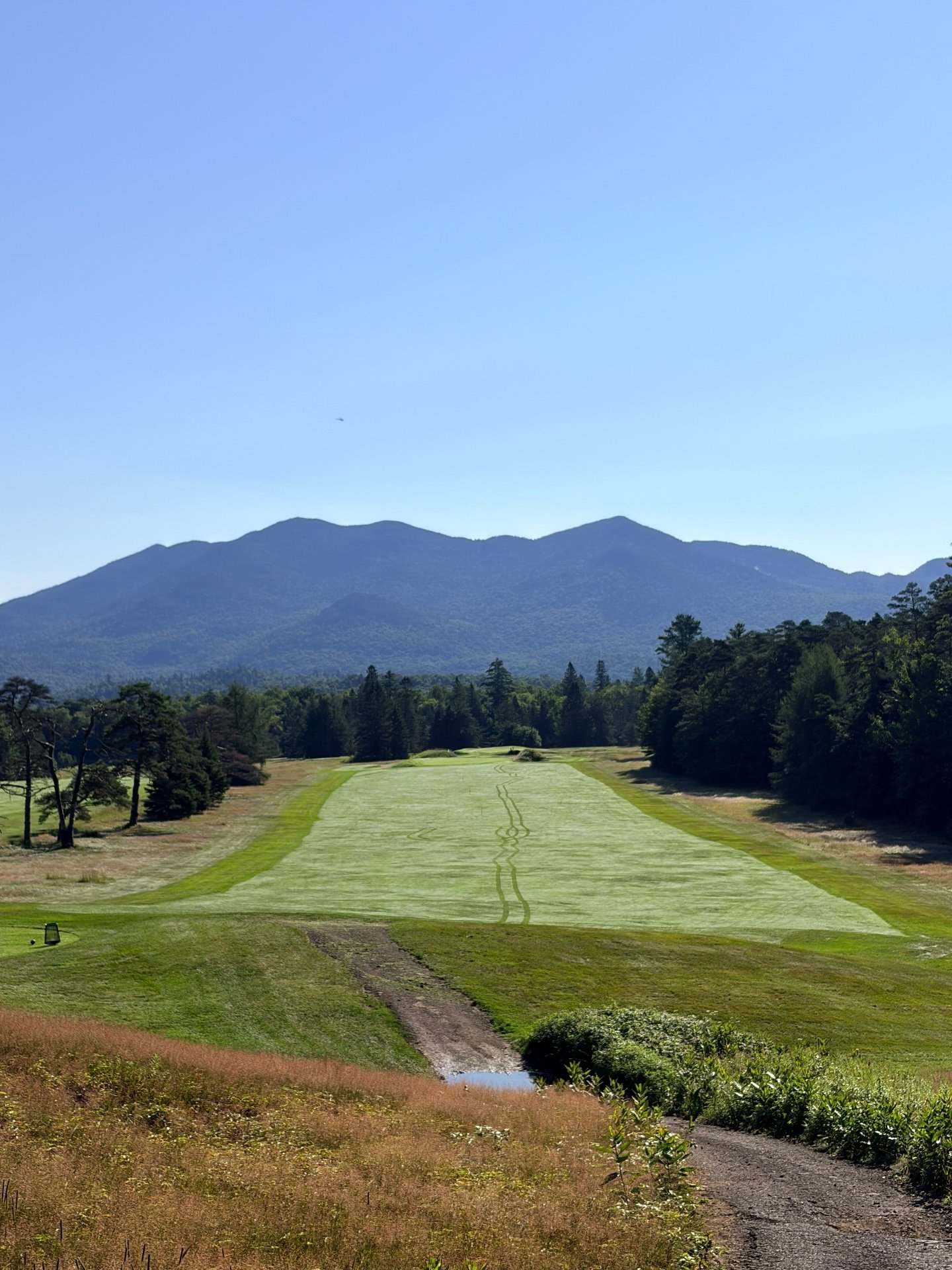 Fairway view at Lake Placid Club Mountain Course with Adirondack peaks beyond